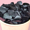 Tub of Zoi&co's signature Velvet Ebony hydrangea bits in rich black