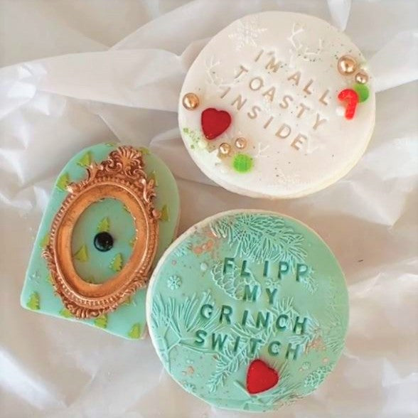 christmas cookies showing the pinecone wishes tile cookie embosser zoiandco