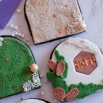 christmas cookies using the pinecone wishes tile cookie embosser zoiandco