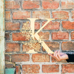 Floral Monogram Wood in front of brick wall - Sign - Zoi&Co