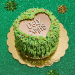 green cake with a heart cake mirror sheet representing the words ugly xmas - Zoi&Co