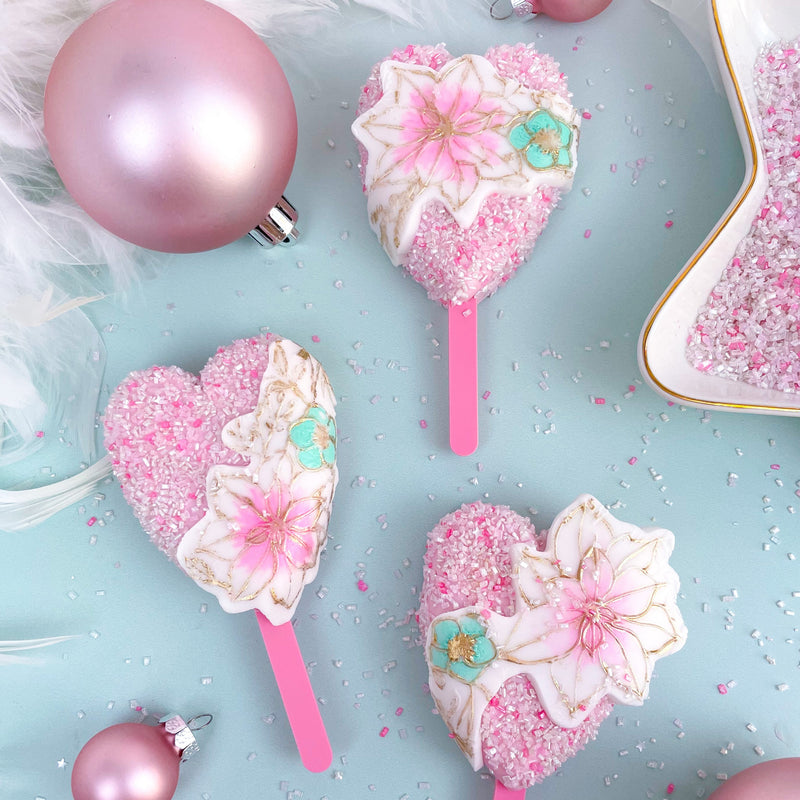 rose glitter heart shaped cakesicles showing the pink candy forest mini cakesicle sticks zoiandco