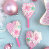 heart shaped glitter cakesicles showing the pink candy forest mini cakesicle sticks zoiandco
