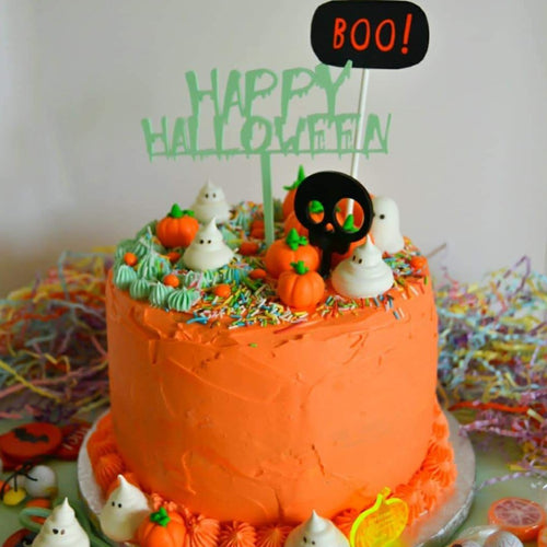 orange cake showing the happy halloween cake topper zoiandco