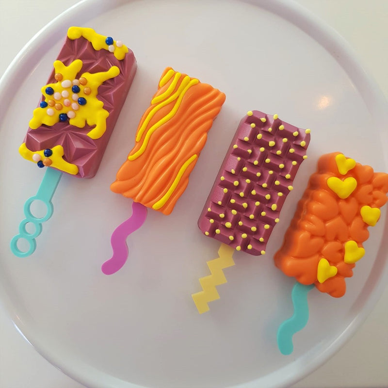 colorful cakesicles showing the bubbly standard cakesicle stick zoiandco