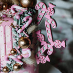cake with pastel pink & green candy cane side cake topper - close up - zoi&co