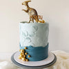 mint & petrol cake with a gold dinosaur & a wooden hooray topper showing the moonlight cake stencil - zoiandco